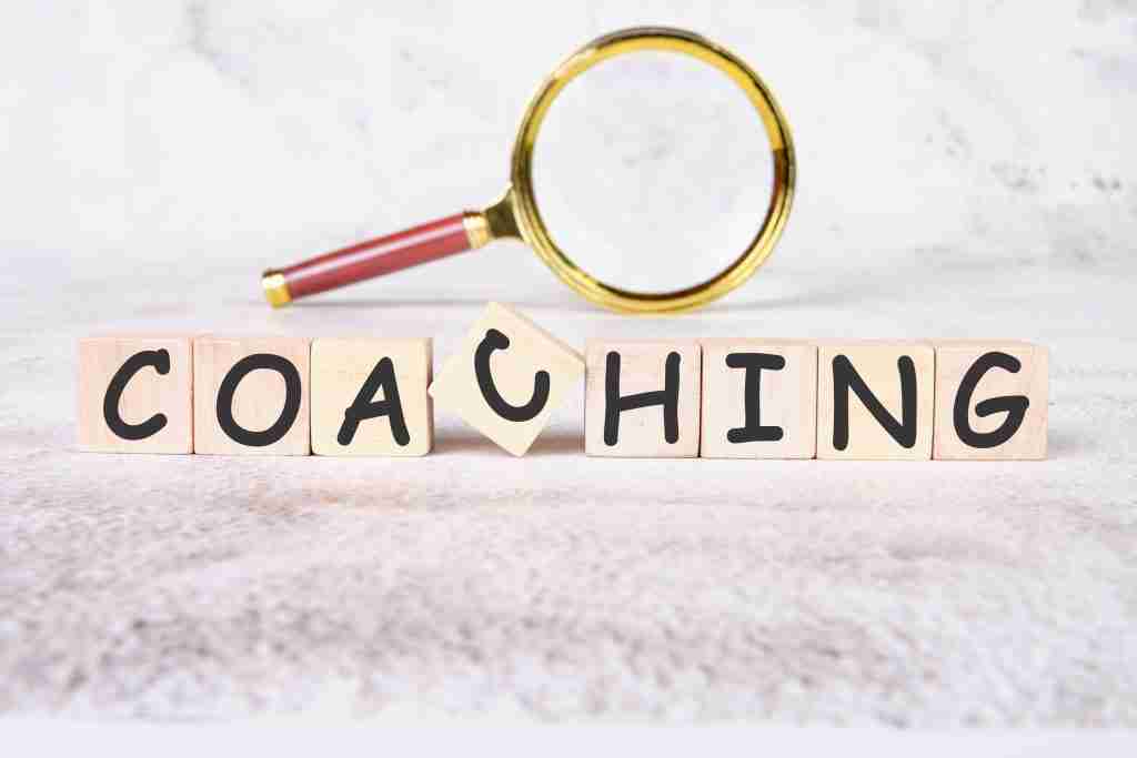 COACHING a word written on wooden cubes